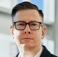 Executivo Alexander Hughes, CEO de empresa atuante em negociação de criptomoedas 